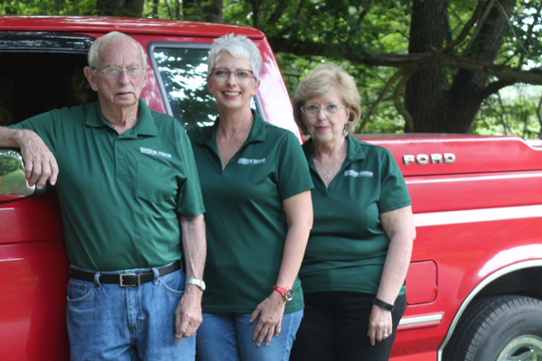 Debbie Tommy and Bennie by the truck